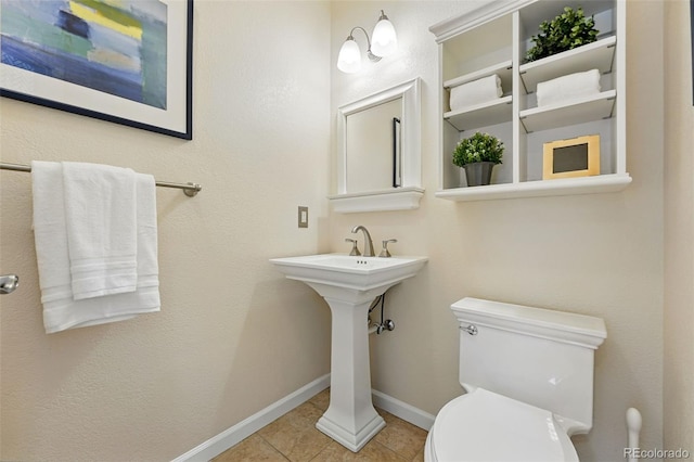 9556 Kemper Dr, Lone Tree, CO 80124 - half bathroom featuring toilet and tile patterned flooring
