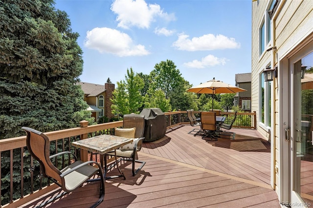 9556 Kemper Dr, Lone Tree, CO 80124 - wooden terrace with outdoor dining area