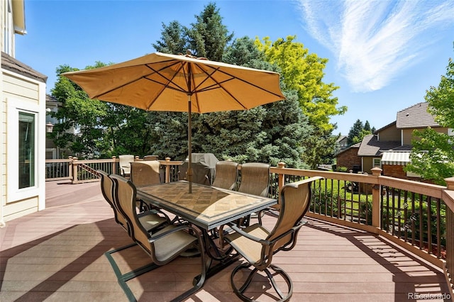 9556 Kemper Dr, Lone Tree, CO 80124 - wooden deck featuring outdoor dining area