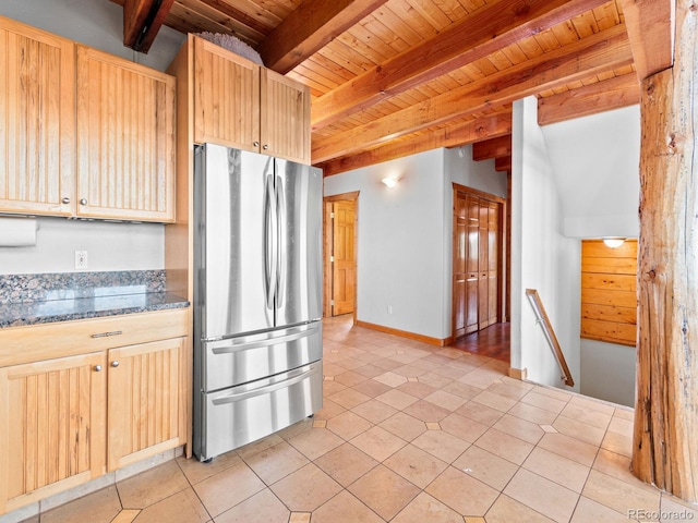 11766 Coal Creek Heights Dr, Golden, CO 80403 - kitchen with freestanding refrigerator, wood ceiling, beamed ceiling, light brown cabinetry, and light tile patterned flooring