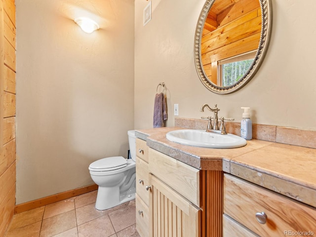 11766 Coal Creek Heights Dr, Golden, CO 80403 - bathroom featuring toilet, tile patterned flooring, and vanity