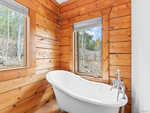 11766 Coal Creek Heights Dr, Golden, CO 80403 - full bath featuring a soaking tub, healthy amount of natural light, and wooden walls