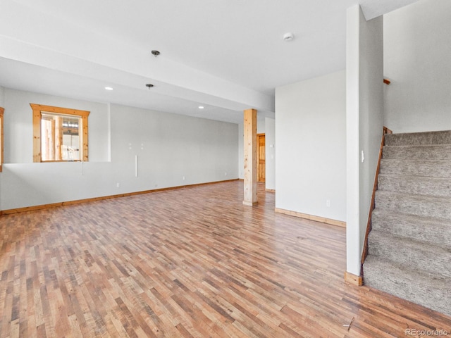 11766 Coal Creek Heights Dr, Golden, CO 80403 - unfurnished living room featuring stairway, wood finished floors, baseboards, and recessed lighting