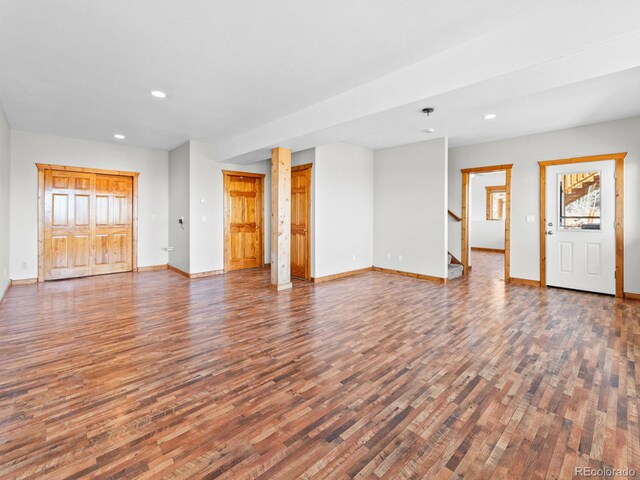 11766 Coal Creek Heights Dr, Golden, CO 80403 - unfurnished living room with wood finished floors, recessed lighting, baseboards, and stairs