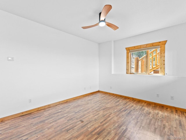 11766 Coal Creek Heights Dr, Golden, CO 80403 - empty room featuring baseboards, wood finished floors, and ceiling fan