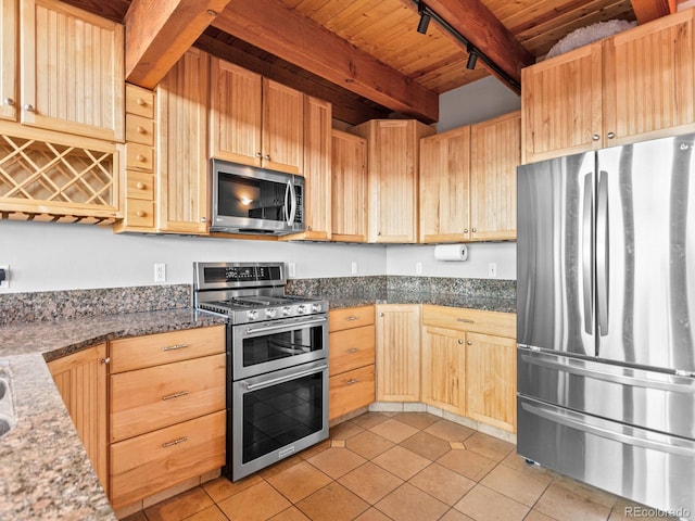 11766 Coal Creek Heights Dr, Golden, CO 80403 - kitchen with stainless steel appliances, light brown cabinets, wood ceiling, light tile patterned flooring, and beam ceiling