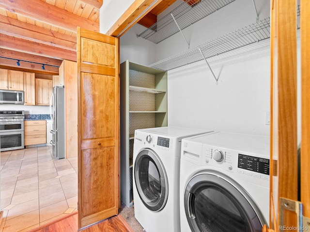 11766 Coal Creek Heights Dr, Golden, CO 80403 - clothes washing area featuring independent washer and dryer