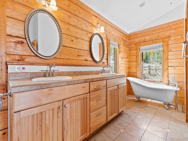 11766 Coal Creek Heights Dr, Golden, CO 80403 - full bathroom with vaulted ceiling, double vanity, tile patterned floors, and a soaking tub
