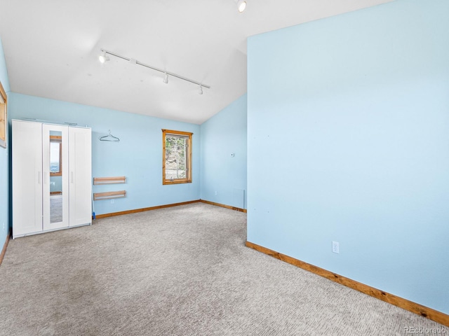 11766 Coal Creek Heights Dr, Golden, CO 80403 - carpeted spare room with rail lighting and baseboards