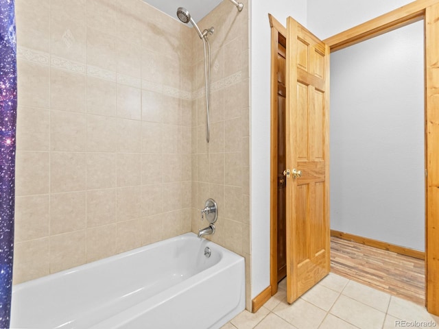 11766 Coal Creek Heights Dr, Golden, CO 80403 - full bathroom with tile patterned floors, shower / bathtub combination, and baseboards