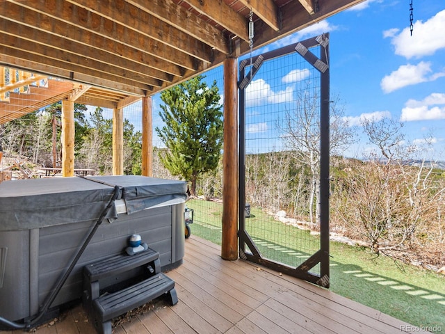 11766 Coal Creek Heights Dr, Golden, CO 80403 - wooden deck featuring a hot tub and a lawn