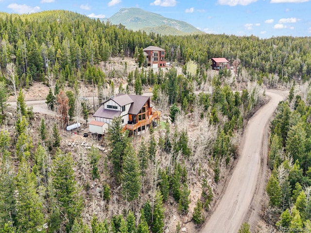 11766 Coal Creek Heights Dr, Golden, CO 80403 - aerial view of property and surrounding area with a forest and mountains