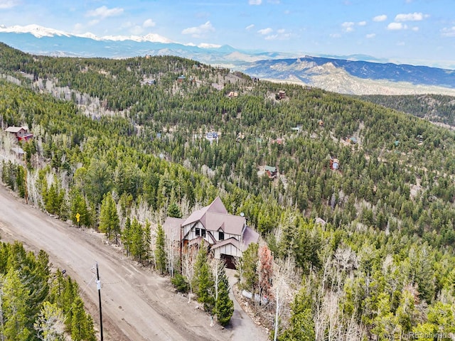 11766 Coal Creek Heights Dr, Golden, CO 80403 - view of subject property featuring a heavily wooded area and a mountainous background