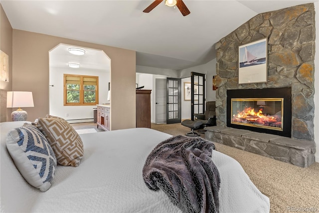 192 Nova Dr, Pine, CO 80470 - carpeted bedroom with baseboard heating, lofted ceiling, a fireplace, and a ceiling fan