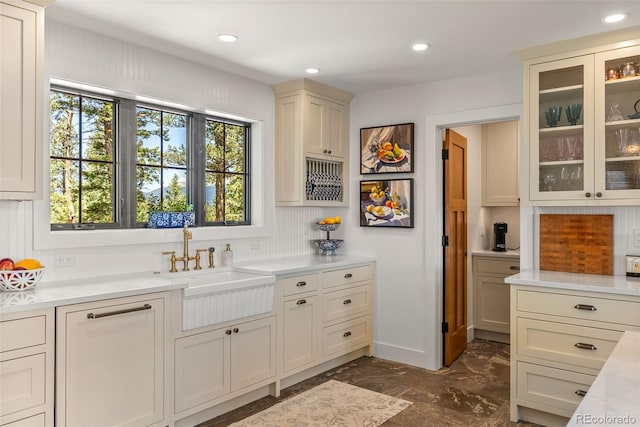 192 Nova Dr, Pine, CO 80470 - kitchen with light countertops, dark marble finish floors, glass insert cabinets, and recessed lighting