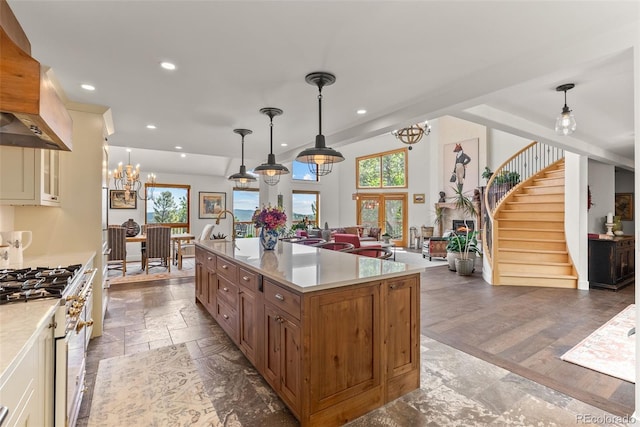 192 Nova Dr, Pine, CO 80470 - kitchen featuring custom range hood, a chandelier, stainless steel range, recessed lighting, and open floor plan