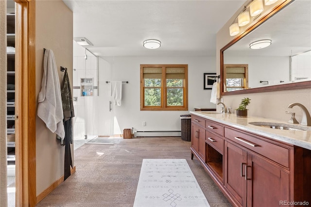 192 Nova Dr, Pine, CO 80470 - full bath featuring baseboard heating and double vanity