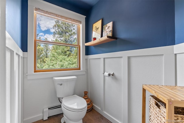 192 Nova Dr, Pine, CO 80470 - bathroom featuring baseboard heating and a wainscoted wall