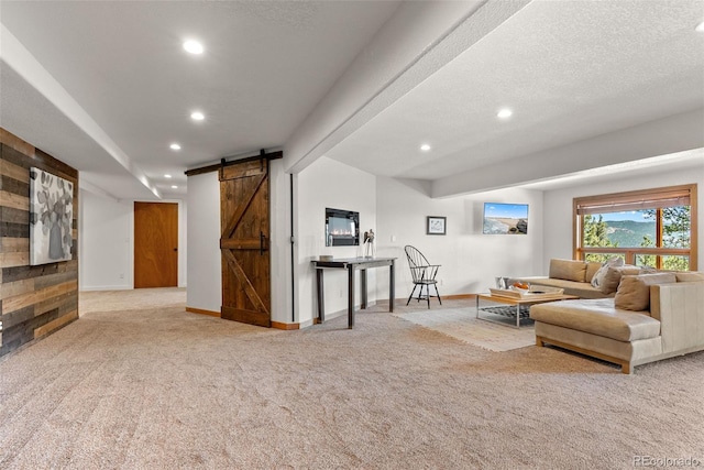 192 Nova Dr, Pine, CO 80470 - carpeted living area with a barn door and recessed lighting