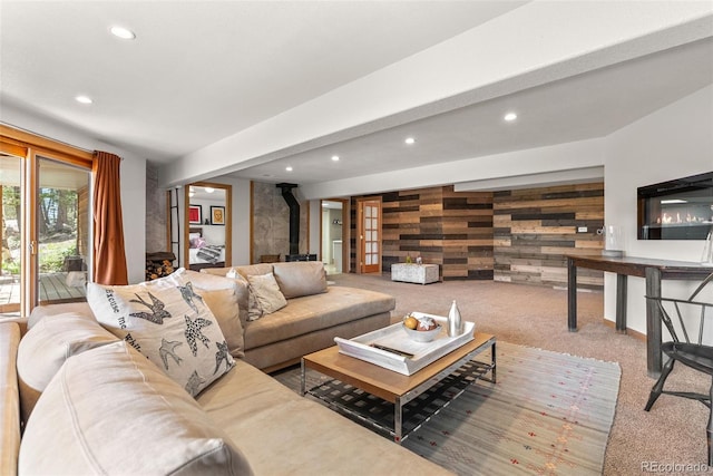 192 Nova Dr, Pine, CO 80470 - carpeted living room with a wood stove, recessed lighting, and wooden walls