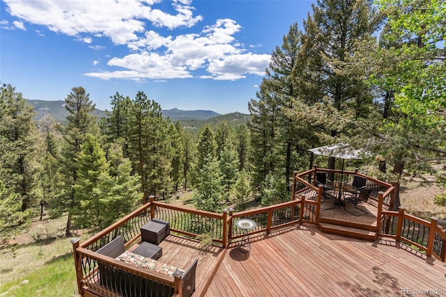 192 Nova Dr, Pine, CO 80470 - deck with a mountain view, grilling area, and a wooded view