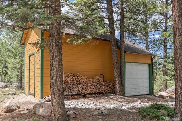 192 Nova Dr, Pine, CO 80470 - view of side of home featuring an outbuilding and a shingled roof