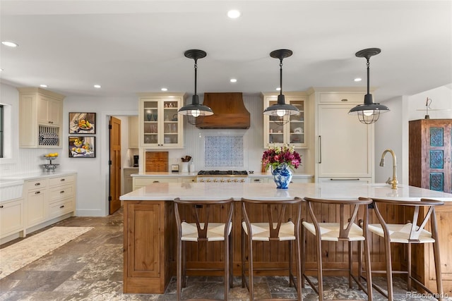 192 Nova Dr, Pine, CO 80470 - kitchen with premium range hood, light countertops, backsplash, glass insert cabinets, and recessed lighting