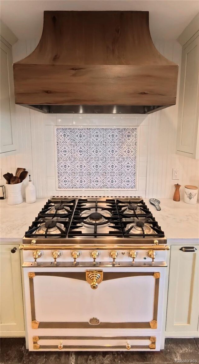 192 Nova Dr, Pine, CO 80470 - kitchen view of exhaust hood, light countertops, backsplash, and stainless steel stove