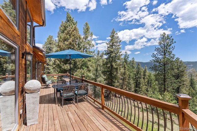 192 Nova Dr, Pine, CO 80470 - wooden deck with a wooded view