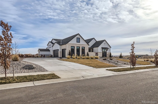 modern farmhouse style home featuring a garage