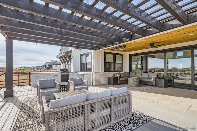 view of patio / terrace with a wooden deck, grilling area, outdoor lounge area, and a pergola