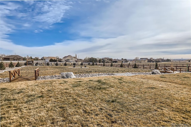 view of yard with a rural view