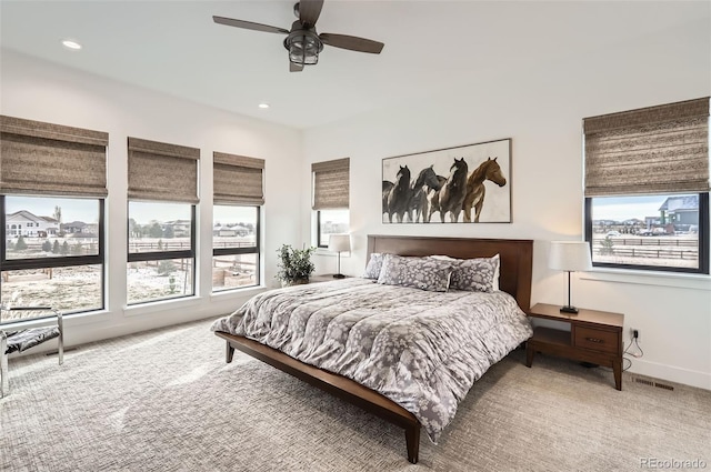 carpeted bedroom with ceiling fan