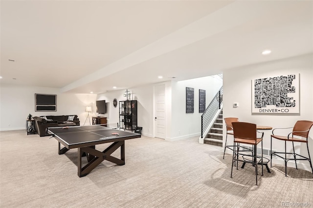 recreation room featuring light carpet