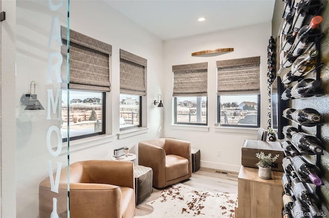 sitting room featuring light hardwood / wood-style floors