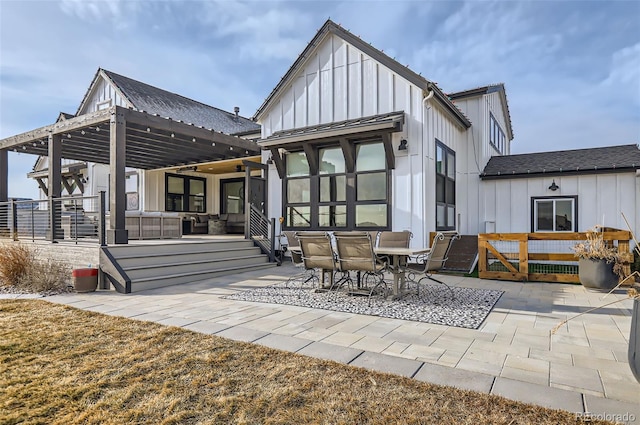 rear view of property featuring an outdoor hangout area and a patio