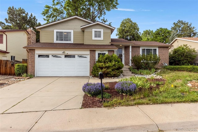 18625 E Kent Dr, Aurora, CO 80013 - view of front of home with a garage, concrete driveway, and brick siding