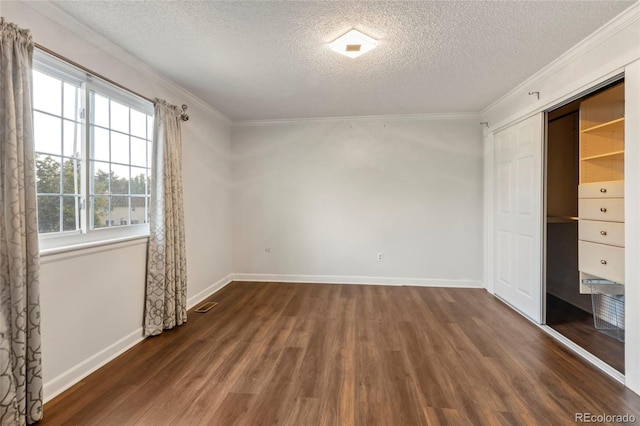 18625 E Kent Dr, Aurora, CO 80013 - unfurnished bedroom with wood finished floors, a textured ceiling, ornamental molding, and a closet