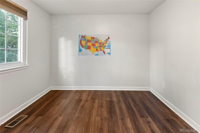 18625 E Kent Dr, Aurora, CO 80013 - spare room with dark wood-type flooring and plenty of natural light