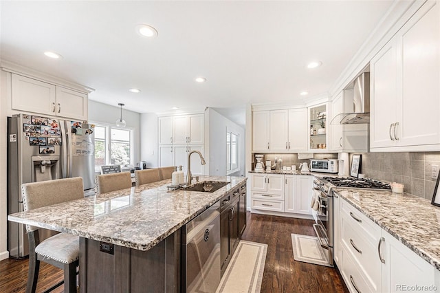 5265 S Cathay Way, Centennial, CO 80015 - kitchen featuring appliances with stainless steel finishes, wall chimney exhaust hood, white cabinetry, dark wood-type flooring, and recessed lighting