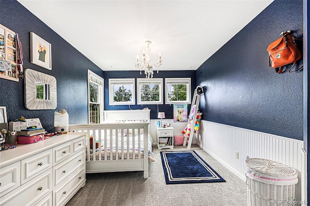 5265 S Cathay Way, Centennial, CO 80015 - bedroom featuring a textured wall, a chandelier, and dark carpet