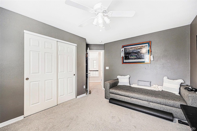 5265 S Cathay Way, Centennial, CO 80015 - bedroom featuring carpet floors, a closet, a textured wall, and a ceiling fan