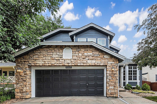 5265 S Cathay Way, Centennial, CO 80015 - view of front facade with stone siding, a garage, and concrete driveway