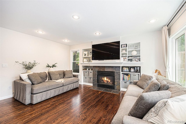 5265 S Cathay Way, Centennial, CO 80015 - living area with dark wood-style floors, a tile fireplace, and recessed lighting