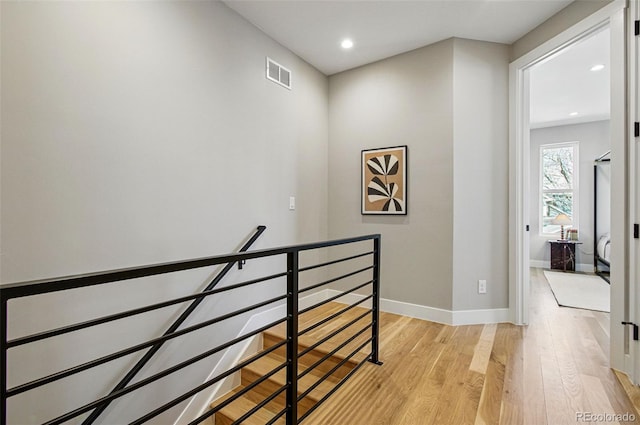 4127 Tejon St, Denver, CO 80211 - hallway featuring an upstairs landing, light wood-style flooring, baseboards, and recessed lighting