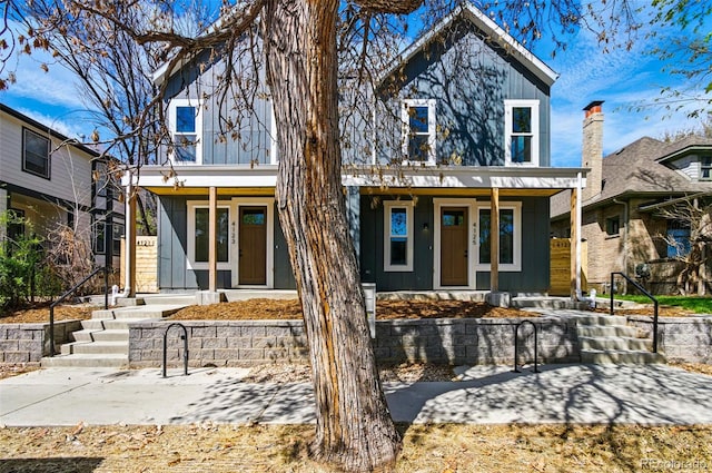 4127 Tejon St, Denver, CO 80211 - view of front facade featuring covered porch and board and batten siding