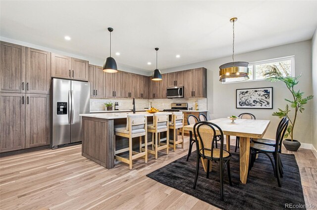 4127 Tejon St, Denver, CO 80211 - dining room featuring light wood finished floors and recessed lighting