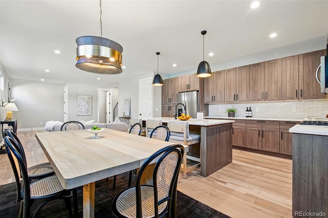 4127 Tejon St, Denver, CO 80211 - dining room featuring recessed lighting, light wood-type flooring, and baseboards