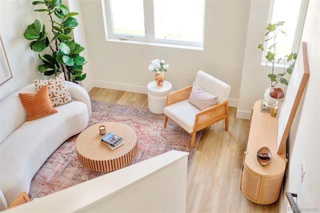 interior space featuring baseboards and wood finished floors