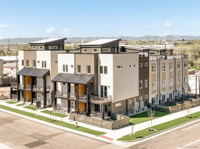 2105 S Galapago St Unit 4, Denver, CO 80223 - view of property featuring a mountain view